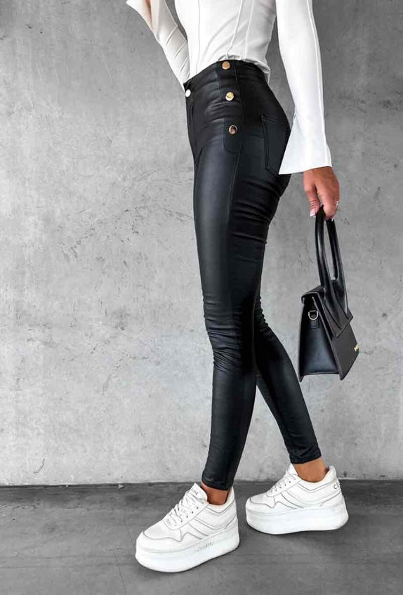 Women's high-waisted skinny cut faux leather pants with gold buttons